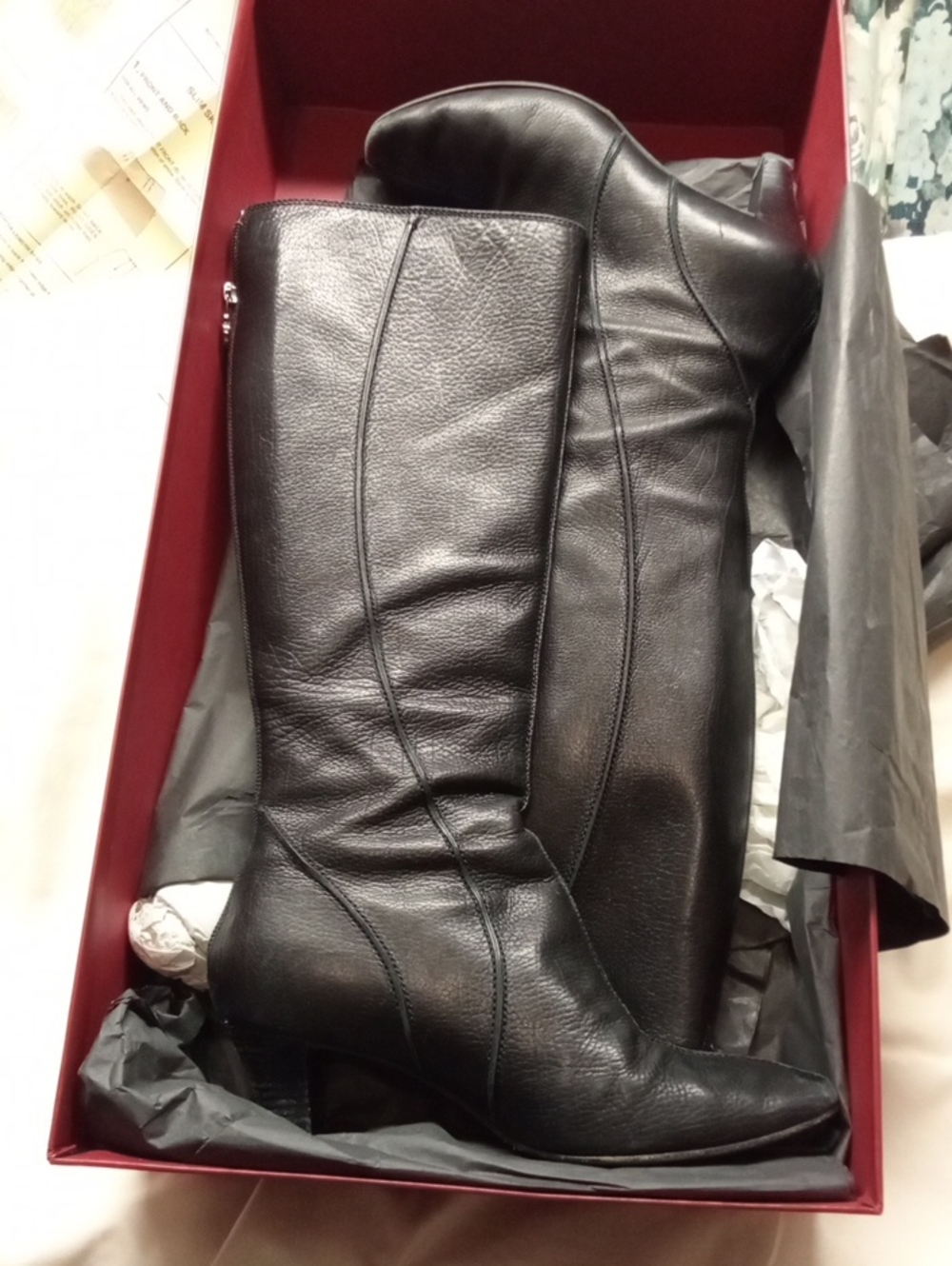 Knee-high black leather boots